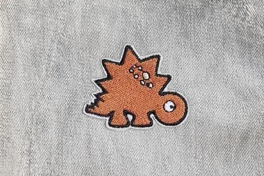 Dino-Patch Stegosaurus in Orange // Patch bzw. Aufnäher